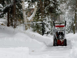 Clearing snow with a snow blower