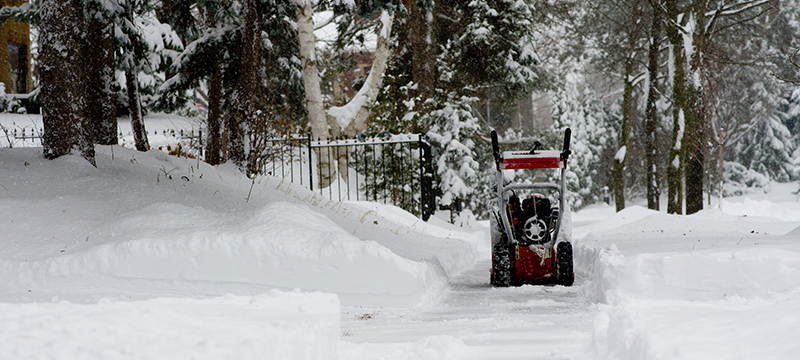 Clearing snow with a snow blower
