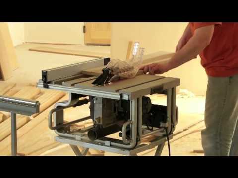 woodworker ripping a board on a table saw