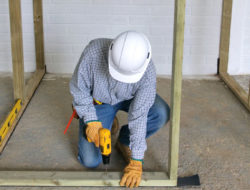 Carpenter building a wall.