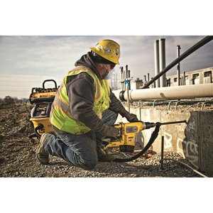 Worker using DeWalt Cordless Hammerdrill and Vacuum