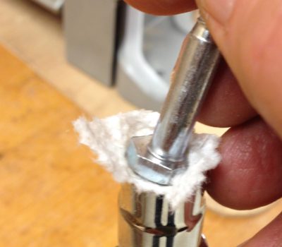 Place some paper towel inside your socket to hold the bolt on tight when you cannot use 2 hands.