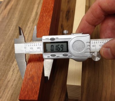 find the difference of two pieces of wood by using a caliper