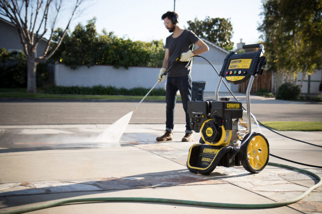 Using a consumer-grade pressure washer to clean a driveway