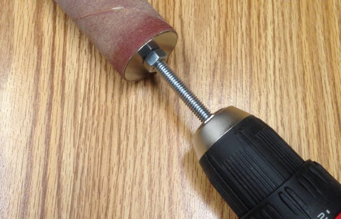 Use a sanding sleeve and long bolt chucked into your drill to sand those hard to reach places.