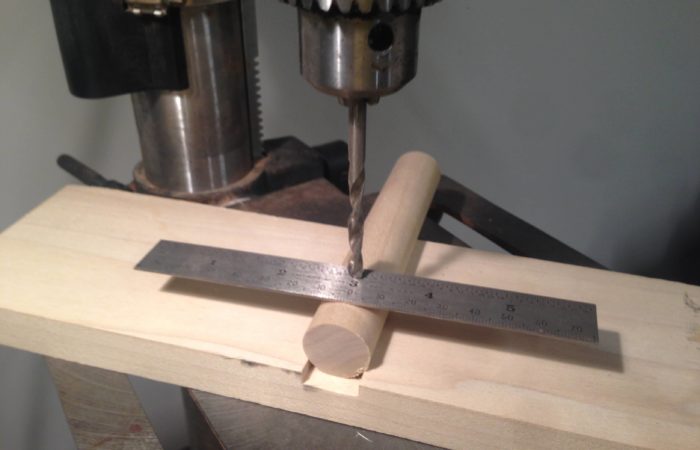 Balance a ruler on a dowel to know if you are drilling into the center of the dowel