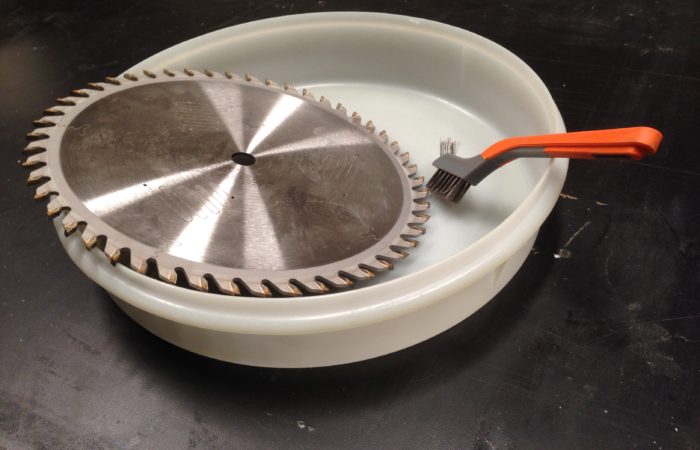 use an inexpensive pie plate lid to assist in cleaning blades to keep liquid from splashing out