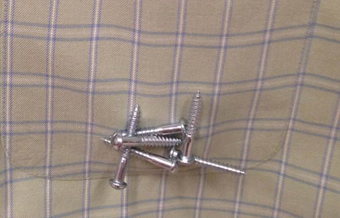 Screws held on the outside of a pocket by a magnet so they are easily accessible.