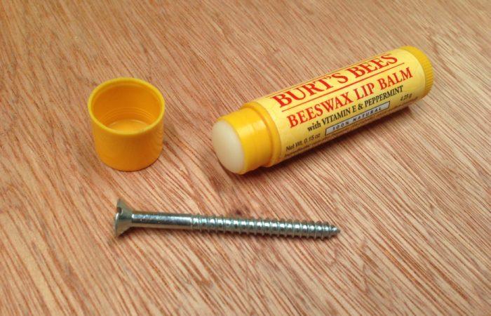 Apply some lip balm to screws to make them easier to drive.