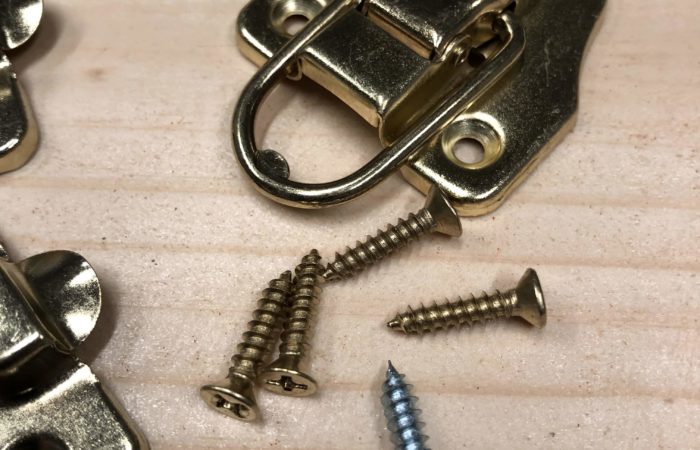 To prevent brass screws from stripping first use a steel screw of the same size to cut the threads.