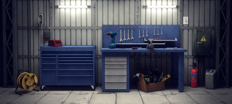 A garage organized with different tool storage systems.