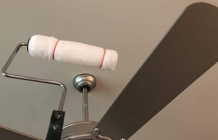 Use a dryer sheet wrapped around a paint roller to clean ceiling fans