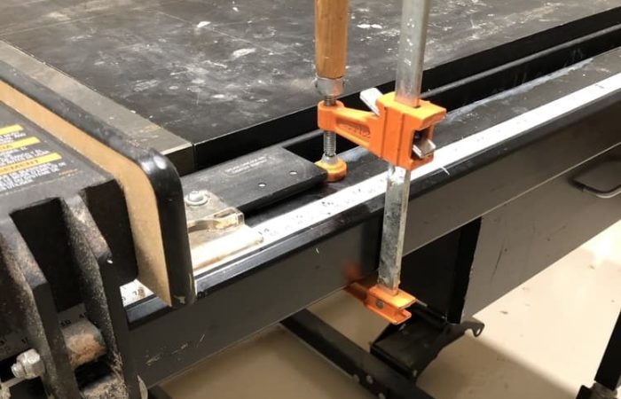 By using a clamp on the fence to a table saw it will give you a quick reference stop to make repeatable cuts.