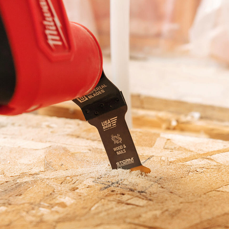 Milwaukee oscillating multi tool using an Imperial Blades Wood & Nails blade to cut through plywood.