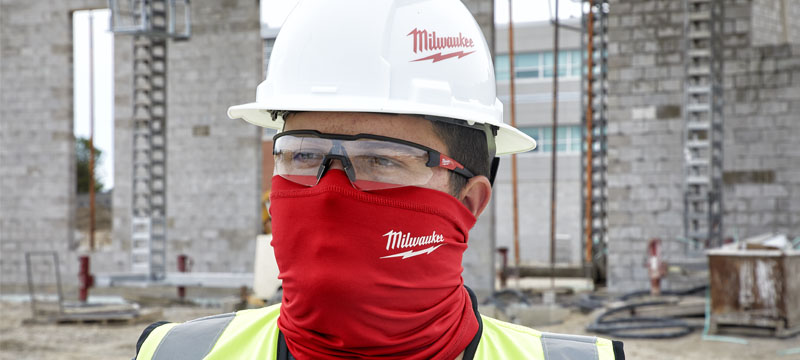 Contractor wearing a red Milwaukee neck gaiter