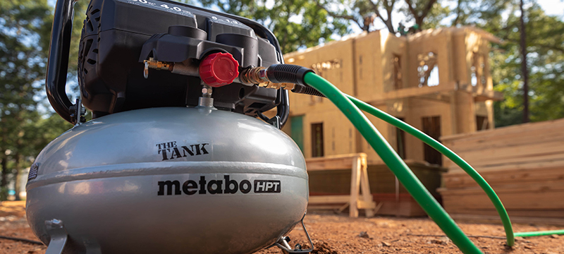 Metabo HPT's The Tank pancake compressor sits on a jobsite.