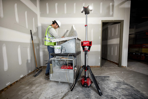 A worker uses the Milwaukee M18 ROCKET Tower Light at a jobsite.