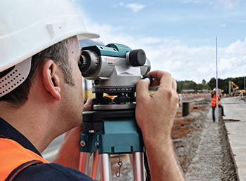 A surveyor uses a Bosch Automatic Optical Level.