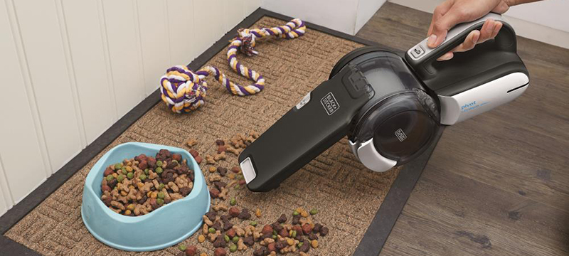 A Black & Decker 20 volt cordless handheld vacuum to clean up dog food.