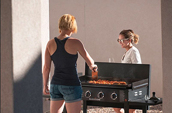 https://blog.acmetools.com/wp-content/uploads/2021/04/A-Woman-Cooks-On-A-Blackstone-Griddle.jpg