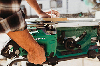 The Metabo HPT Jig Saw is used to cut a piece of baseboard from underneath.