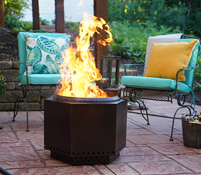 A fire roars on a Dragonfire Smokeless Fire Pit.