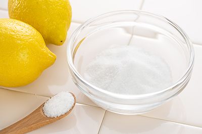 Citric acid powder in a bowl.