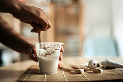 Baking soda is mixed with water for scrubbing tools.