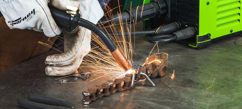 A Forney Industries Easy Weld 140 Multi-Process Welder is used to repair a metal chain.