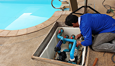 Water is drained from the plumbing of an inground swimming pool.