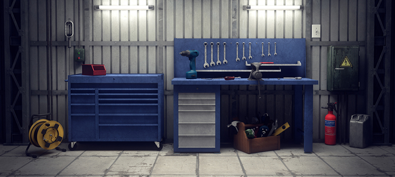An organized workbench in a garage.