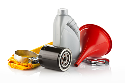 Tools needed for an engine oil change, such as a funnel, oil filter, oil, rag, open-end wrench, and a oil filter wrench.