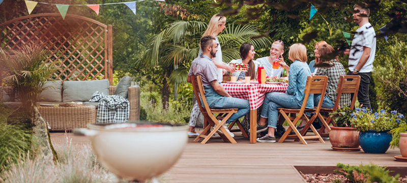 A group eats together on a patio.