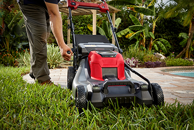 The single point height adjustment handle is adjusted on the M18 FUEL 21-Inch Self-Propelled Dual Battery Mower.