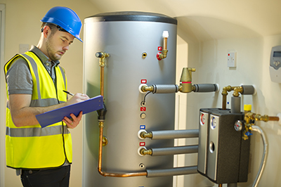 A professional check on a water heater.