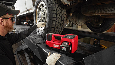 Milwaukee M18 Inflator used to fill a truck tire.