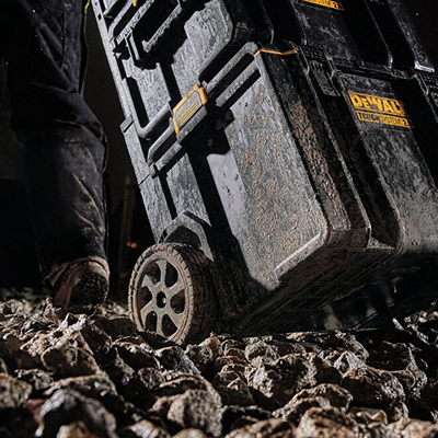 A DEWALT ToughSystem 2.0 Storage System is pulled through some rough terrain.