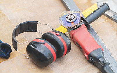 A damaged grinding wheel attached to an angle grinder.