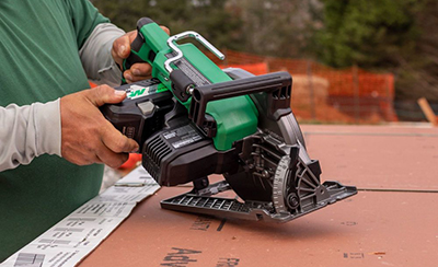 A battery is changed out on a Metabo HPT Rear Handle Circular Saw.