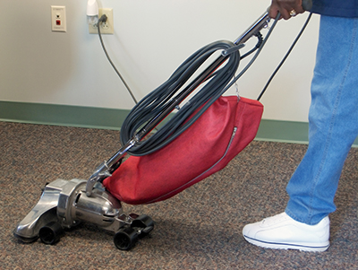 Carpet is cleaned with a bagged vacuum.