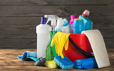 A bucket full of cleaning supplies.