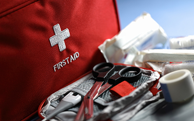 Supplies from a first aid kit sitting on a table.
