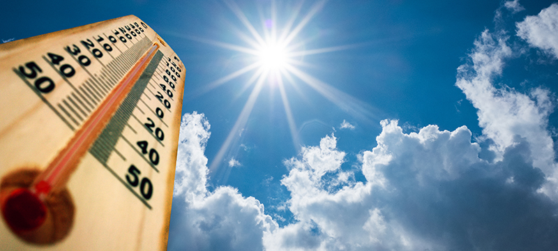 A thermometer roasts under a hot sun.