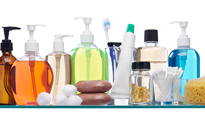 Several toiletries sit on a shelf.