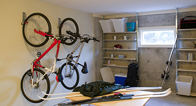 Bikes are hung on a wall.