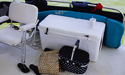 A cooler sits on a boat.