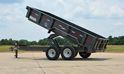 A Diamond C dump trailer sits in a tilted position.