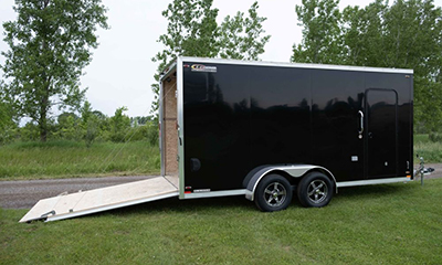 The ramp of a Legend Premium Trailers enclosed trailer sits open.