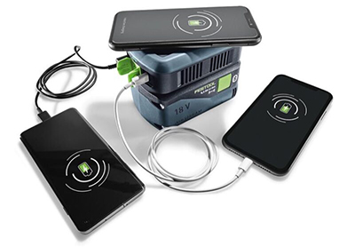 Three phones charge on the Festool PHC 18 Mobile Phone Charger.