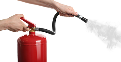 Suppressant is released from a fire extinguisher.